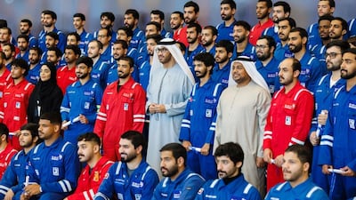 Dr Sultan Al Jaber, Minister of Industry and Advanced Technology and managing director and group chief executive of Adnoc, with graduates. Photo: Wam
