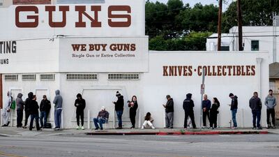 People queue to enter a gun store in Culver City, California. AP