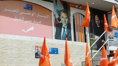 Posters of Lebanese President Michel Aoun (right) and his son-in-law and leader of Lebanon's Free Patriotic Movement, Gebran Bassil, at the party's office in Sin El Fil, Lebanon. Reuters