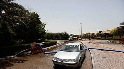 Pumping operations cleared most of the water in the area near Ibn Battuta Mall, Dubai, but traffic disruptions remained yesterday. Satish Kumar / The National