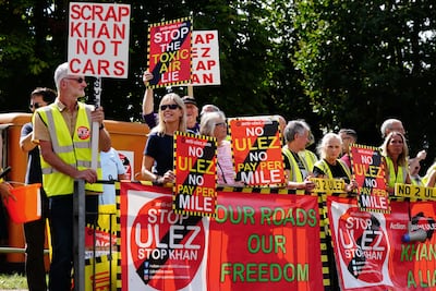 People protest against the proposed ultra-low emissions zone expansion in Orpington, near London. PA