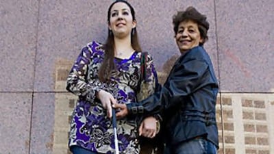 Hala Bana, right, has been teaching blind people how to deal with and overcome diverse aspects they are faced with.