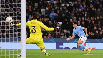 Rico Lewis scores for Manchester City. Getty
