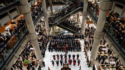 City workers attend a Remembrance Day ceremony at Lloyd's of London. PA