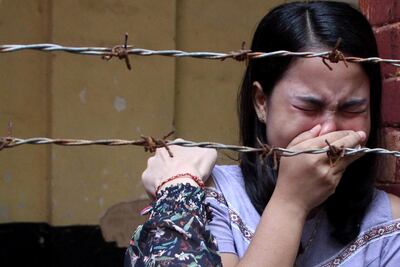 Chit Suu Win, wife of Reuters journalist Kyaw Soe Oo, cries after he was sentenced at Insein court in Yangon, Myanmar September 3, 2018. Reuters