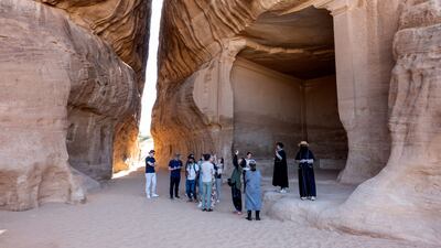 Tourists take a tour of the ancient Nabataean site of Hegra in AlUla, Saudi Arabia. Bloomberg