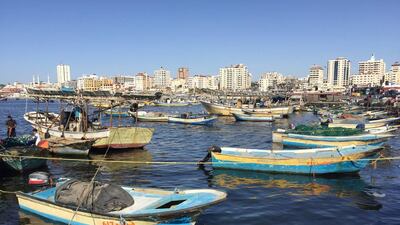 Palestinian fishermen prepare their net before fishing at the seaport of Gaza City. Suhaib Salem / Reuters
