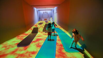Children play in the projected rooms at the Museum of the Future Tour at the Madinat Jumeirah. Victor Besa for The National.