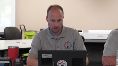 Brandon Ellis, director of Emergency Services for Georgetown County, South Carolina at his desk at the county's emergency response command centre. Willy Lowry / The National