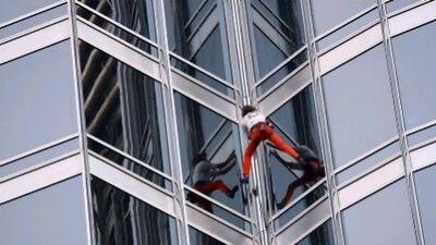 Alain Robert was obliged to wear safety equipment to climb the Burj Khalifa last March. Satish Kumar / The National
