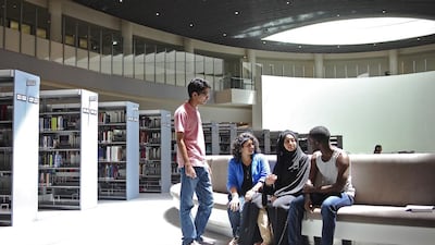 From left, Mohammad Mirza, Sangeetha Mahadevan, Hayat Hassan and Rodger Iradukunda at NYU Abu Dhabi’s library on the first day of term. Lee Hoagland / The National