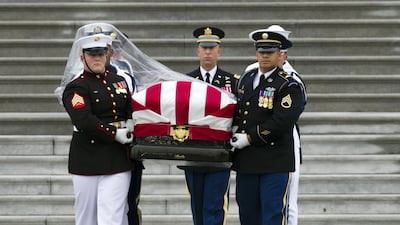 The casket of Senator John McCain is carried to a hearse from the US Capitol. AP