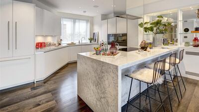 Gaggenau appliances are used throughout the elegant bespoke open-plan kitchen including ovens, fridge freezer, dishwasher and wine storage.. Courtesy Berkshire Hathaway HomeServices London