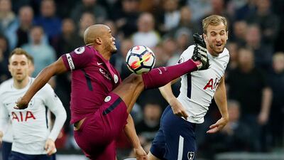 Manchester City's Vincent Kompany in action with Tottenham's Harry Kane. David Klein / Reuters