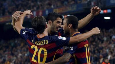 Barcelona’s Neymar, Luis Saurez and Sergi Roberto celebrate a goal against Rayo Vallecano on Saturday night in their La Liga win at the Camp Nou. Albert Gea / Reuters