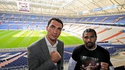 Klitschko, left, and Haye poses for photographers during a press conference. Clemens Bilan / AFP