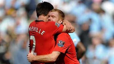 United's Dimitar Berbatov , second left, celebrates with teammate Ryan Giggs and Darren Gibson, far left, after scoring his third goal against Birmingham.
