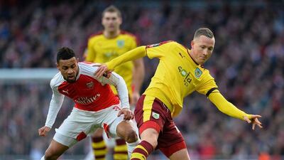 Arsenal's Francis Coquelin challenges Burnleys' Frederik Ulvestad on Saturday in their FA Cup contest at the Emirates Stadium. Glyn Kirk / AFP