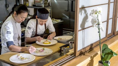 Chef Niki Nakayama, left, and assistant chef Carole Lida plate kaiseki meals, which are based on a 13th-century Japanese tradition. AP Photo