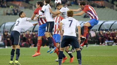 Atletico Madrid and Tottenham Hotspur players jump at the ball during 2016 International Champions Cup Australia match between Tottenham Hotspur and Atletico de Madrid at Melbourne Cricket Ground on July 29, 2016 in Melbourne, Australia. (Photo by Darrian Traynor/Getty Images)