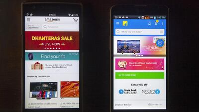 Amazon India, left, and Flipkart, the two biggest online sellers in India, have managed a download of more than 10 million users. Subhash Sharma for The National