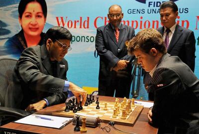 Defending champion Viswanathan Anand of India, left, makes a move against Norway’s Magnus Carlsen during the first game of the World Chess Championship in Chennai in 2013. Carlsen has held the crown since dethroning Anand at the event. AP