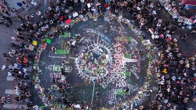 Ariel view of protesters gathered near the makeshift memorial in honour of George Floyd a week after his death in Minneapolis, Minnesota. Major US cities -- convulsed by protests, clashes with police and looting since the death in Minneapolis police custody of Floyd -- braced on Monday for another night of unrest. More than 40 cities have imposed curfews after consecutive nights of tension that included looting and the trashing of parked cars. AFP