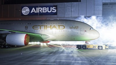 An Airbus A380 rolls out of a paint hangar during a branding ceremony of Etihad Airways. Fabian Bimmer / Reuters