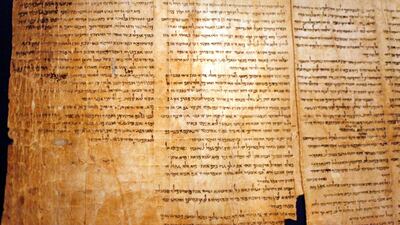 A part of the Isaiah Scroll, one of the Dead Sea Scrolls, is seen inside the Israel Museum. Getty Images