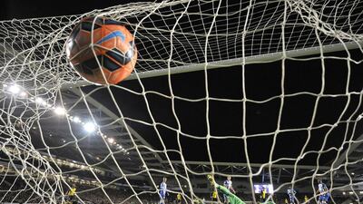 Arsenal's Tomas Rosicky, not seen, scores his team's third goal past Brighton goalkeeper David Stockdale during their FA Cup fourth round match on Sunday. Glyn Kirk / AFP