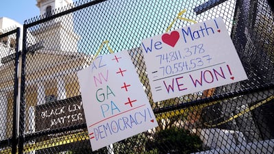Posters displaying election results hang on the fence outside of St. John's Church near the White House. Reuters