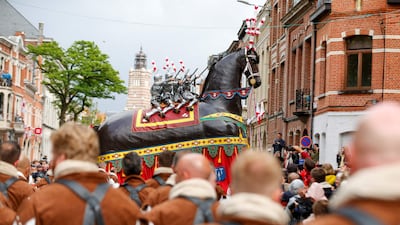 The "Ros Beiaardommegang" procession, featuring a heroic horse from folklore, in Dendermonde, Belgium. The parade should have taken place in 2020 but was postponed twice because of the Covid-19 pandemic. AFP