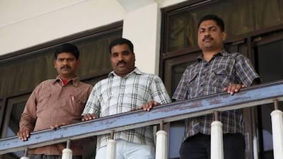 Srinivas Ambati, left, Anil Kumar Sridharan, centre, and Sakeer Hussain Kutty are among the 11 men the Indian Community Welfare Committee has helped to release from prison by raising funds to pay the blood money they owed.