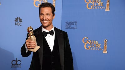 Matthew McConaughey with the award for best actor in a motion picture. AP