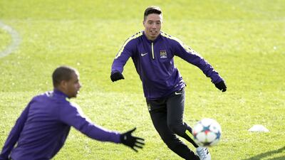 Manchester City’s Samir Nasri, right, was on the bench last year when they met Barcelona in the Uefa Champions League. He plans to be on pitch Tuesday when they meet at Etihad Stadium. Oli Scarff / AFP
