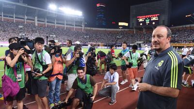 Real Madrid’s head coach Rafael Benitez awaits the International Champions Cup football match between Inter Milan and Real Madrid in Guangzhou on July 27, 2015. AFP PHOTO / JOHANNES EISELE