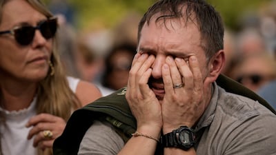 A man overcome with emotion in Hyde Park. AP
