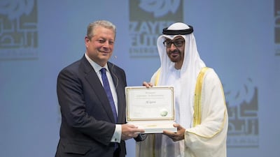 Sheikh Mohammed bin Zayed, Crown Prince of Abu Dhabi and Deputy Supreme Commander of the UAE Armed Forces, presents the Zayed Future Energy Prize Lifetime Achievement award to former US vice president Al Gore during the opening ceremonies of the World Future Energy Summit. Donald Weber / Crown Prince Court - Abu Dhabi