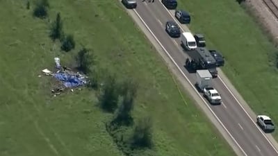 Wreckage lies in a field next to Butler Memorial Airport after a plane carrying skydivers crashed in Butler, Missouri. Reuters