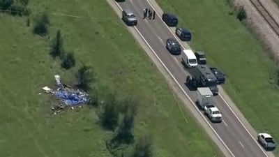 Wreckage lies in a field next to Butler Memorial Airport after a plane carrying skydivers crashed in Butler, Missouri. Reuters