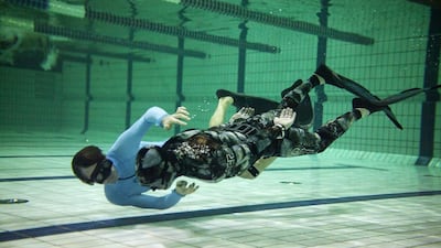Alex Boulting, co-founder of Freediving UAE, leads a training session at the Armed Forces Officers Club in Abu Dhabi. Christopher Pike / The National