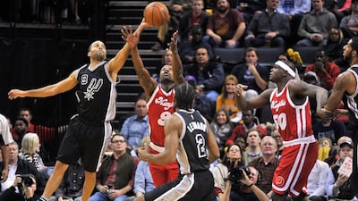 San Antonio Spurs guard Tony Parker, left, and Memphis Grizzlies forward Tony Allen battle for control of the ball in the first half of an NBA basketball game Thursday, Dec. 3, 2015, in Memphis, Tenn. (AP Photo/Brandon Dill)