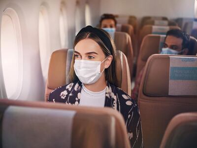 Face masks on flights and in airports are compulsory. Courtesy Etihad