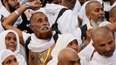 Pilgrims cast their stones. Reuters