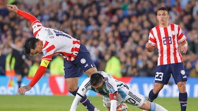 Lionel Messi of Argentina vies for the ball with Gustavo Gomez of Paraguay. EPA