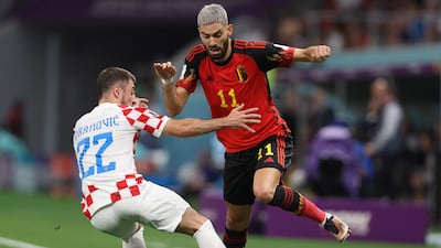 Josip Juranovic, left, of Croatia battles for possession with Yannick Carrasco of Belgium. EPA