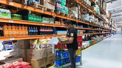 A worker fulfills a customer's order at a warehouse of Bigbasket, an e-grocer operated by Supermarket Grocery Supplies, in Bengaluru, India. Bangalore-based Bigbasket is a sign of the changing times: it delivers everyday cooking essentials like ghee, diced coconut and fragrant basmati rice, as well as 18,000 other items from bread to laundry detergent to eight million customers in 25 Indian cities. Bloomberg