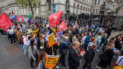 Health workers, nurses and union members march past Downing Street in London on a previous strike this month. EPA