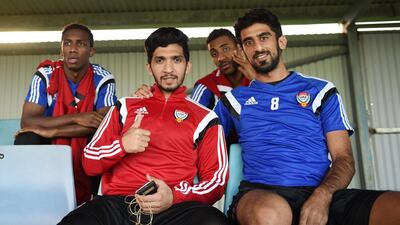 Amer Abdulrahman, front left, and Hamdan Al Kamali pose for a picture.