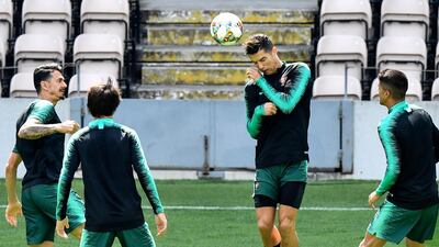 Portugal's Cristiano Ronaldo heads the ball during a training session at the Bessa stadium in Porto. AP Photo